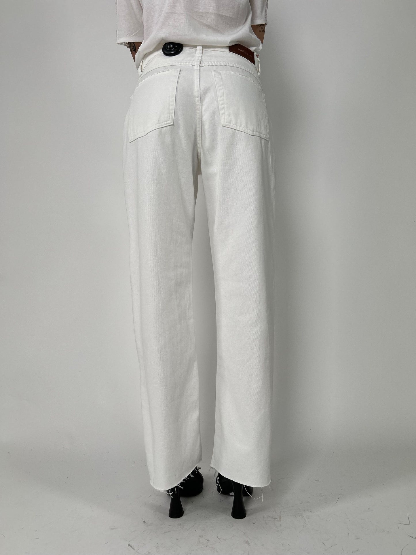 Pantalone cinque tasche a taglio vivo