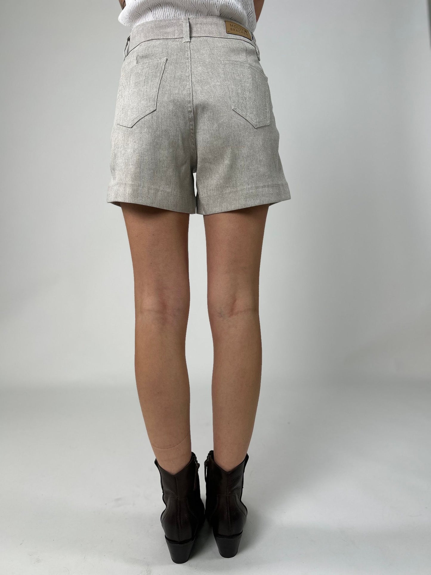 Short con allacciatura ad un bottone più zip